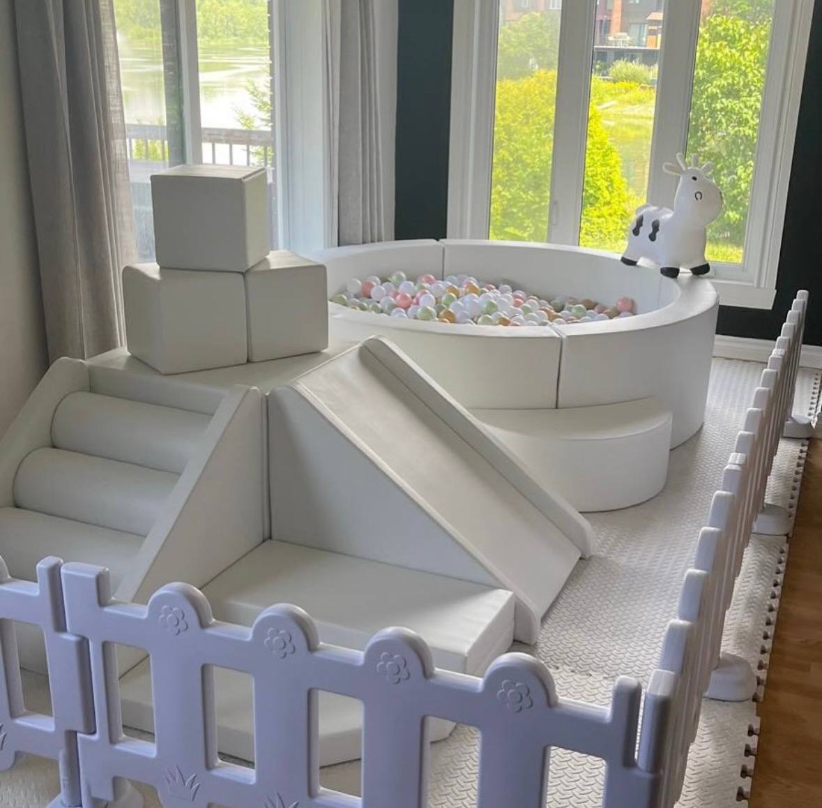 Full Happi Hop soft play setup with round ball pit, pyramid climber and safety fence